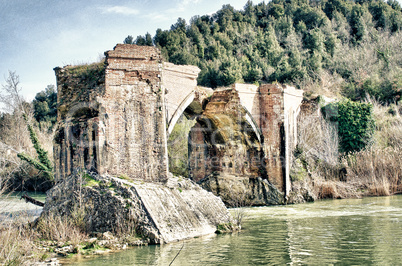 Ancient Medieval Bridge over a Creek in the Tuscany Countryside