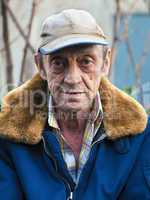 Portrait of a elderly man outdoors closeup