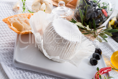 soft cheese with spicy olives