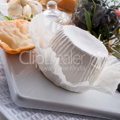 soft cheese with spicy olives