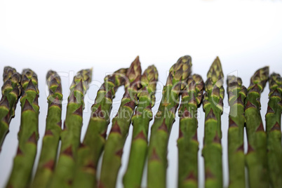 Green raw asparagus isolated on white