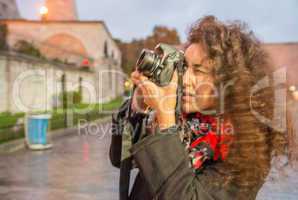 Young tourist woman taking a picture of Hagia Sophia in Istanbul