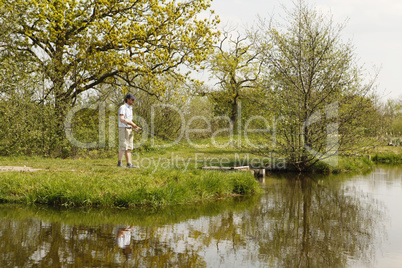 Fishermen at a fishing pond