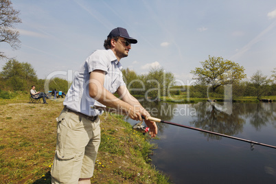 Fisherman with rod in the hand