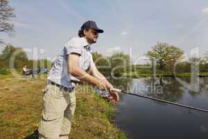 Fisherman with rod in the hand