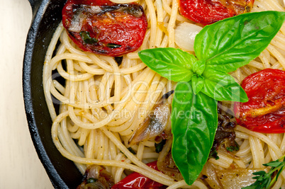 spaghetti pasta with baked cherry tomatoes and basil