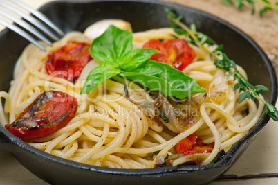 spaghetti pasta with baked cherry tomatoes and basil