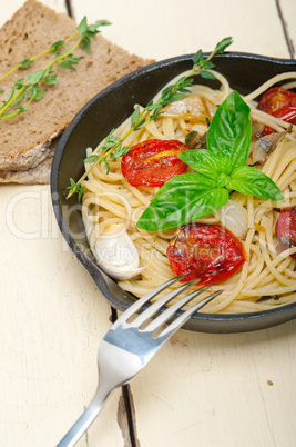 spaghetti pasta with baked cherry tomatoes and basil