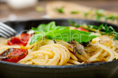 spaghetti pasta with baked cherry tomatoes and basil