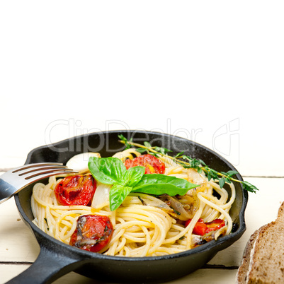 spaghetti pasta with baked cherry tomatoes and basil