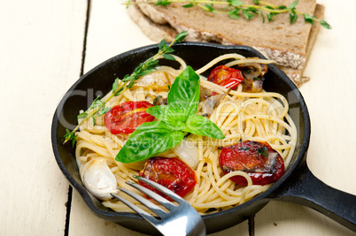 spaghetti pasta with baked cherry tomatoes and basil