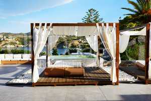 Modern hut and sunbeds at luxury hotel, Crete, Greece