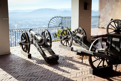 Old cannon on gun carriage aims to Graz