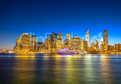 Amazing Manhattan skyline from Brooklyn after sunset with river