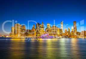 Amazing Manhattan skyline from Brooklyn after sunset with river