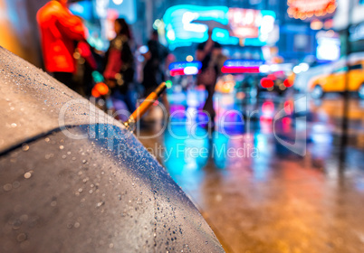 Open umbrella on a rainy night in Times Square - New York City