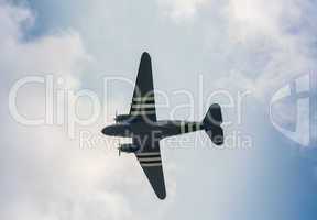 Military airplane as seen from the ground against blue sky