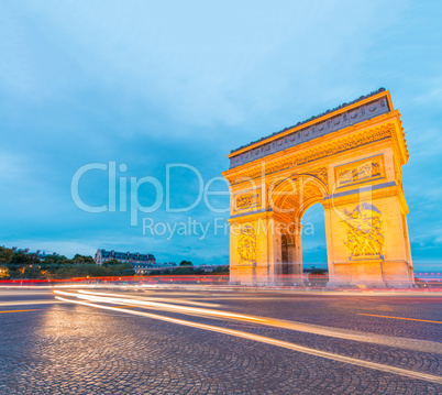 Amazing sunset view of Triumph Arc in Paris with Etoile Roundabo