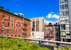 Highline Park in Manhattan with city skyline on a beautiful day