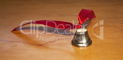 Bell with red ribbon