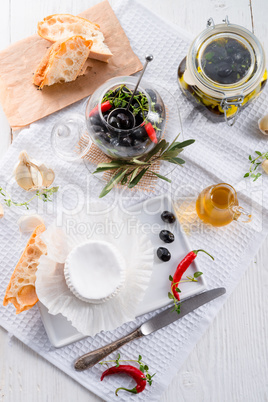 soft cheese with spicy olives