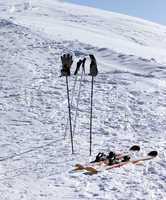 Skiing equipment on ski slope at sunny day