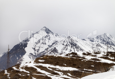 Winter mountains and gray sky