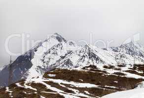 Winter mountains and gray sky