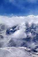 Ski resort in mist and sunlight sky