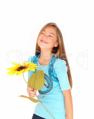 Girl smiling with sunflower.