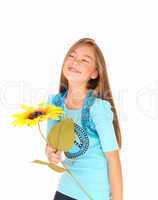 Girl smiling with sunflower.