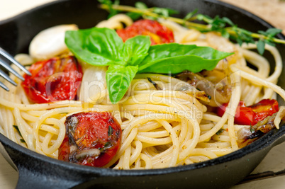 spaghetti pasta with baked cherry tomatoes and basil