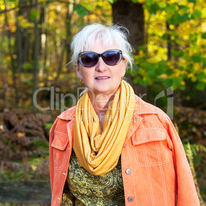Middle-aged woman in autumnal nature