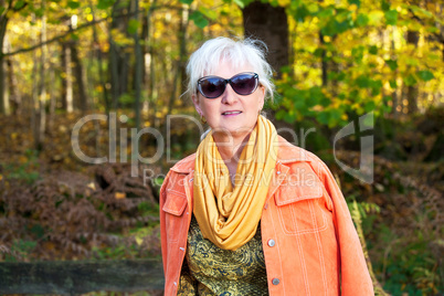 Middle-aged woman in autumnal nature
