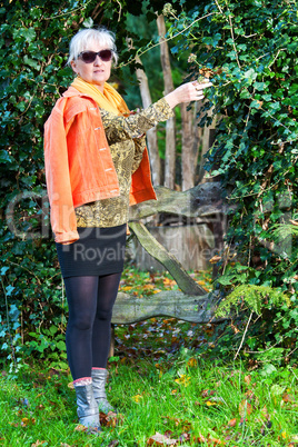 Middle-aged woman in autumnal nature