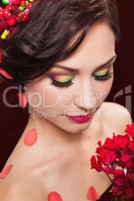 Beautiful young woman with evening make-up in the style of the s