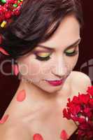 Beautiful young woman with evening make-up in the style of the s
