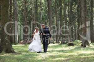Bridal couple on forest glade
