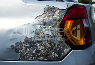 Damaged car, side view