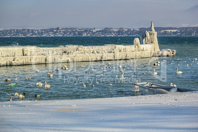 Frozen jetty and lighthouse at Versoix, Geneva, Switzerland