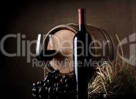 Wine with grape and barrel