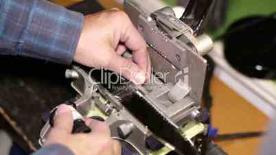 Film Technician Splicing 35mm Film