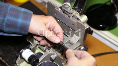 Film Technician Cutting 35mm Film