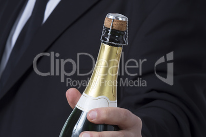 Man in siut with Champagne bottle