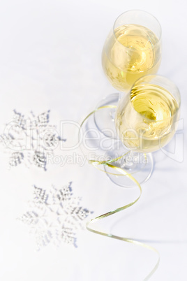 Two glasses of wine and snowflakes