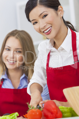 Women Friends Preparing Vegetables Salad Food in Kitchen