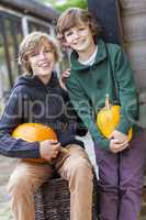 Two Happy Boys Brother With Pumpkins