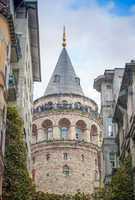 Galata Tower framed by ancient buildings - Istanbul, Turkey