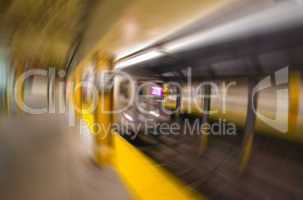 Blurred scene of fast moving train in Manhattan subway - New Yor