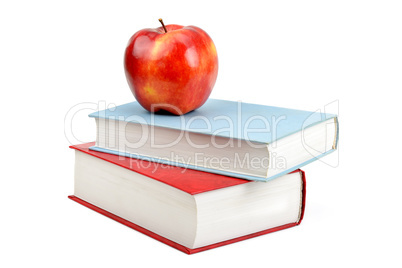 books and red apple isolated on white background